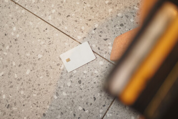 credit Card drops on floor, lost card concept 