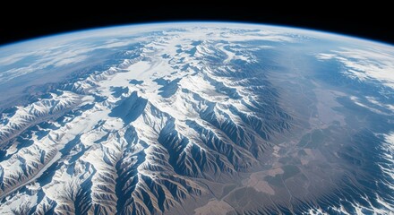 A view from low orbit looking down on the majestic, snow-capped Himalayan mountain range, showing the curvature of the Earth. © Leo
