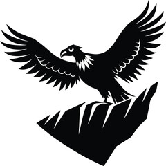 Obraz premium Majestic eagle landing on jagged rocks with wings spread wide in a bold silhouette