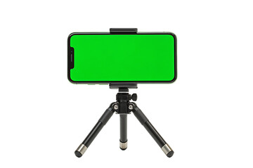 Mobile phone with green screen on a small tripod.