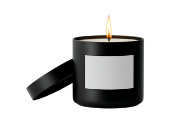 Black candle with blank label, burning in the dark.
