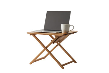 Laptop and coffee mug on a small wooden folding table.