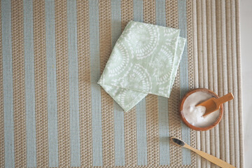 top view of baking soda and cloths on a carpet 