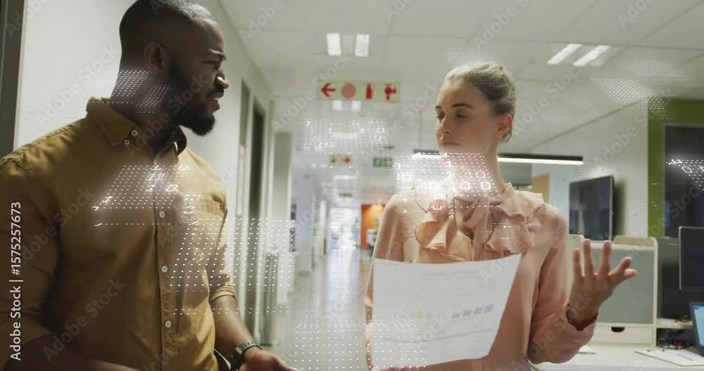 Poster male peer pointing to business report creating animated charts while woman reviewing data in hall