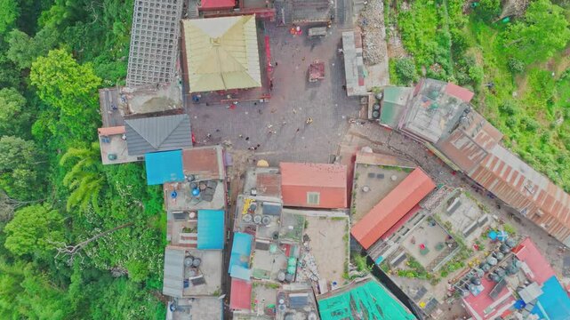 Manakamana Temple, located on a hilltop in Gorkha, Nepal, is a revered Hindu site accessed by cable car. Pilgrims visit to offer prayers and enjoy scenic views of the surrounding mountains and valley.