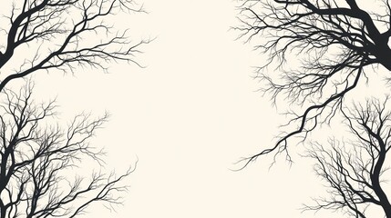 Fototapeta premium Silhouetted bare tree branches frame a light-colored center