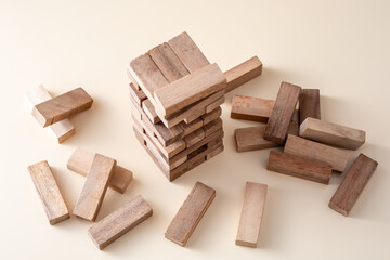 Stacked Wooden Blocks Game with Pieces on Neutral Background