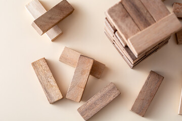 Stacked Wooden Blocks with Isolated Pieces on Neutral Background