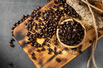 Coffee Beans Spread on Wooden Board with Rustic Background