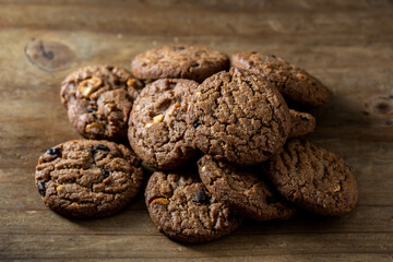 Freshly Baked Chocolate Cookies on Rustic Wooden Surface