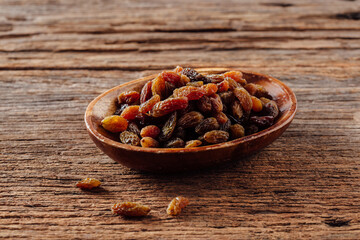 Mixed Dried Fruit on Wooden Table in Rustic Bowl Arrangement