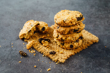 Freshly Baked Oatmeal Cookies with Raisins on Rustic Background