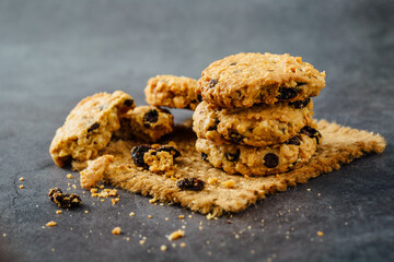 Crunchy Oatmeal Cookies with Raisins Stacked on a Rustic Surface