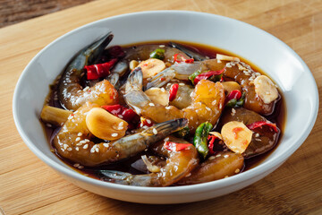 Fresh Shrimp Dish with Spices and Garnishes in White Bowl