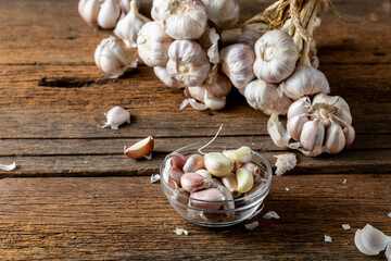 Fresh Garlic Bulbs and Cloves on Rustic Wooden Table Background