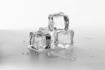 Clear Ice Cubes on a White Background with Water Droplets
