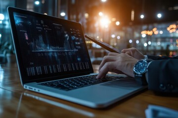 Businessman analyzing digital data on laptop and tablet during nighttime in modern office, Laptop and tablet in use, businessman reviewing digital financial graphs and reports