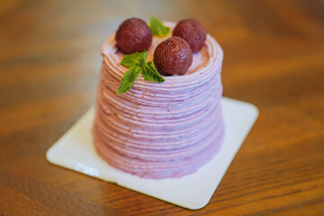 close up of bayberry cream cake on wooden table