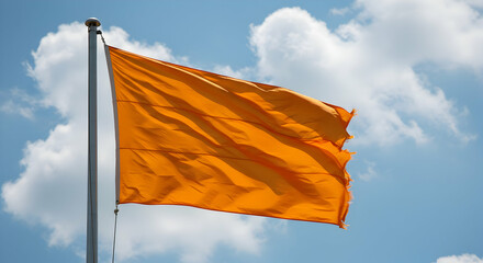 Orange Flag Waving in Blue Sky White Clouds Background Bright Sunny Day