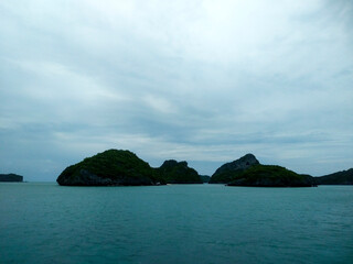 Beautiful Seascape with Mountains, Blue Ocean, and Islands under Clear Sky at Ang Thong National Marine Park, Koh Samui, Thailand