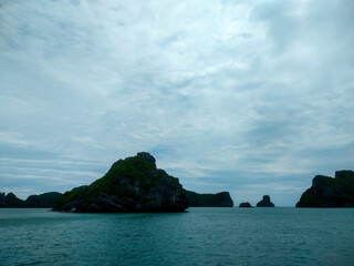 Beautiful Seascape with Mountains, Blue Ocean, and Islands under Clear Sky at Ang Thong National Marine Park, Koh Samui, Thailand