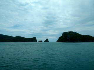 Beautiful Seascape with Mountains, Blue Ocean, and Islands under Clear Sky at Ang Thong National Marine Park, Koh Samui, Thailand