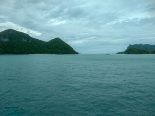 Beautiful Seascape with Mountains, Blue Ocean, and Islands under Clear Sky at Ang Thong National Marine Park, Koh Samui, Thailand