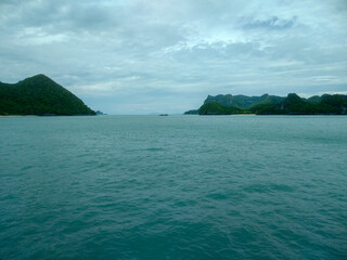 Beautiful Seascape with Mountains, Blue Ocean, and Islands under Clear Sky at Ang Thong National Marine Park, Koh Samui, Thailand