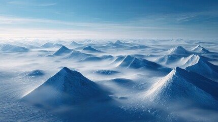 Aerial View of Snowy Mountain Peaks in Winter Fog