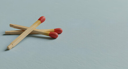 Two crossed matches on a light blue background minimalist concept image