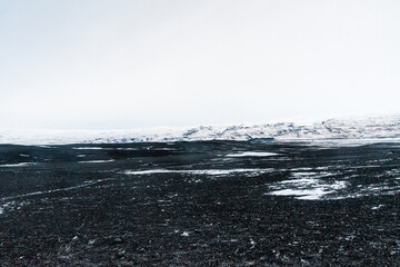 Impression of the black lava beaches near Solheimasandur along the icelandic south coast in Winter