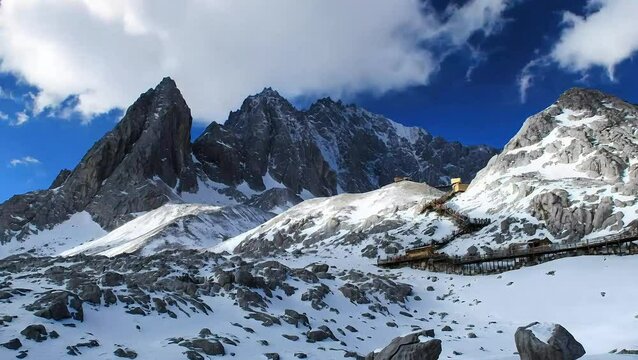 The Jade Dragon Snow Mountain is shrouded in mist and clouds