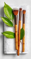 Natural makeup brushes on white towel