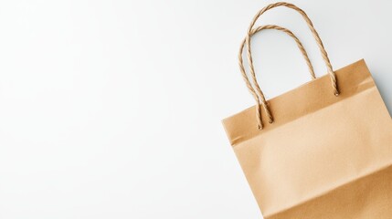 Empty kraft paper shopping bag on a white background.