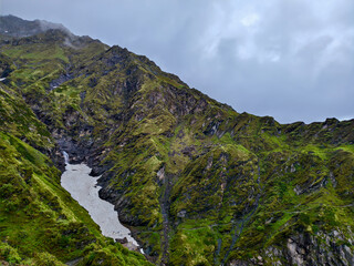 Majestic Snow-Capped Mountain Vista with Lush Green Valley
