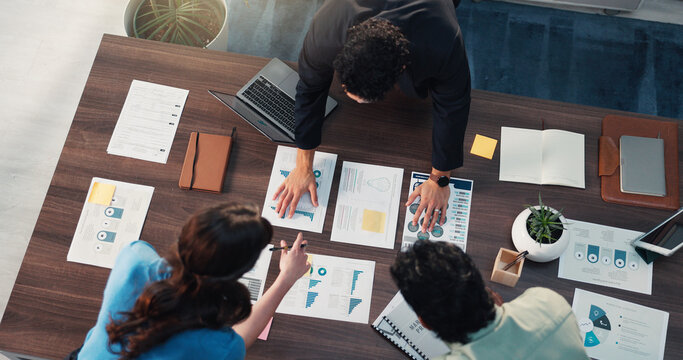 Paperwork, notebook and business people in office for meeting with finance data, statistics or graphs. Documents, writing and top view of financial managers plan for company investment with charts. - Powered by Adobe