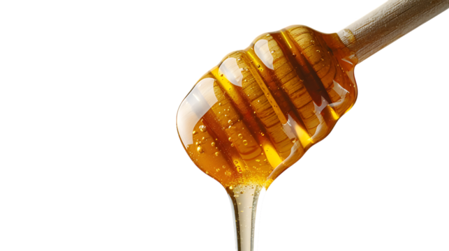 Honey dripping from a wooden dipper isolated on transparent background