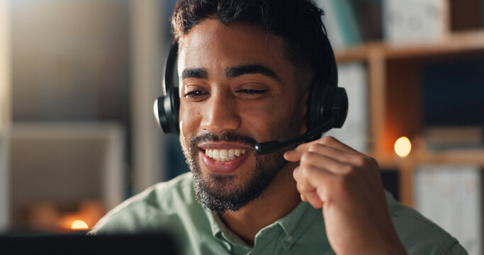 Man, call center and headset for advice at night for communication, help desk and freelance customer service. Mic, laptop and male agent on late shift for telecom, client support or remote work bokeh