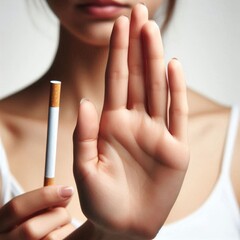 Human hand gesturing stop toward offered cigarette