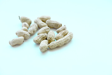 A scattering of fresh shelled peanuts, ready to eat, isolated.