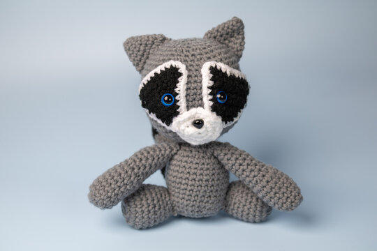 Crochet stuffed animal raccoon.  - Powered by Adobe