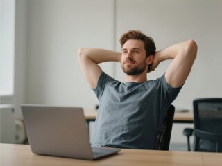 30-year-old caucasian man relaxing with hands behind head in front of laptop in modern office
