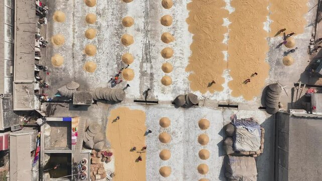 Dhaka, Bangladesh - 01 April 2025: Aerial view of rice mill and drying rice, Bangladesh.