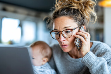 Working mother in a bright home office, multitasking between laptop and baby, realistic and authentic,