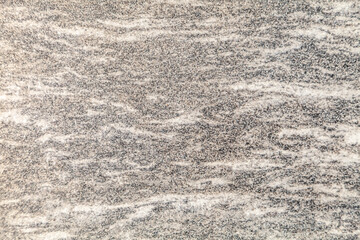 grey speckled anti-slip porcelain tiles on the floor as a background