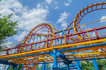 Roller coaster with a blue and yellow track