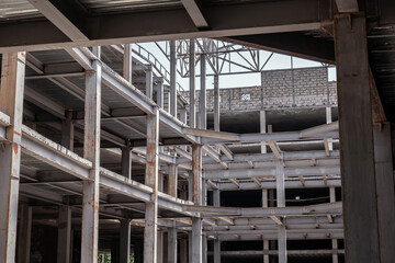 Large, empty building with a lot of exposed steel beams