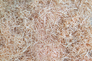 Pile of dry wood chips with a grainy texture