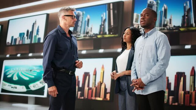 Family Couple Buying New TV In Electronics Shopping Mall. Getting Assistance