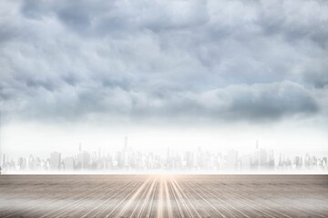 Flat illustration showing empty wood deck extending toward misty city skyline under cloudy sky